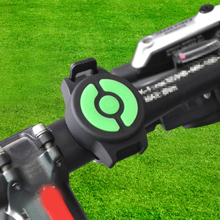 Wireless remote key fob with green power button attached to bike handlebar mount