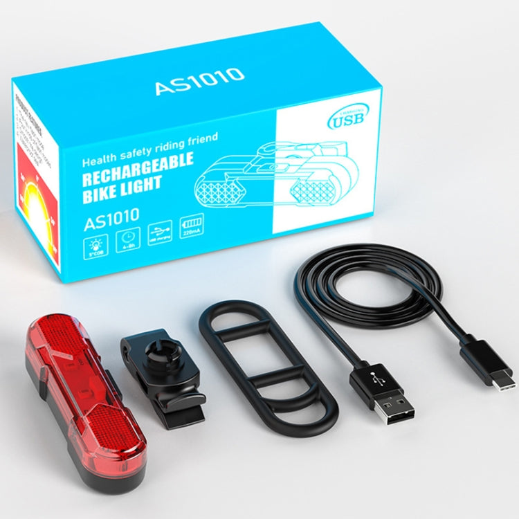 Rechargeable bicycle taillight kit with red light, mounting parts, and USB charging cable