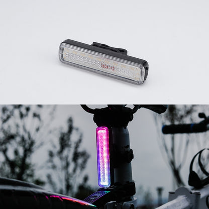 Bike tail light with clear lens and black mounting strap, unlit.