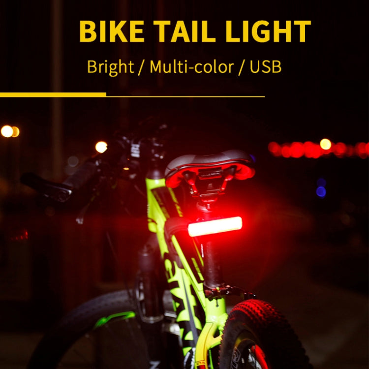 Mounted bike tail light showing multi-color glow; USB power