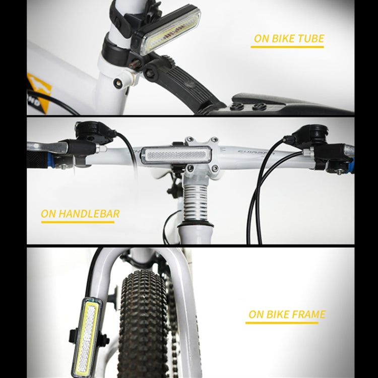 Bike tail light with strap mount, shown on handlebar and bike frame.