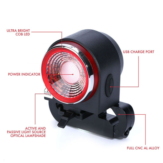 Bike rear light with red circular LED lens and USB charge port, black