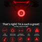 Round bicycle rear taillight glowing red with bright LED ring and central lens