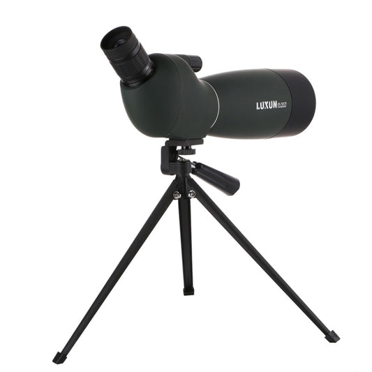 Dark green spotting scope telescope on black tripod with eyepiece and focusing knob