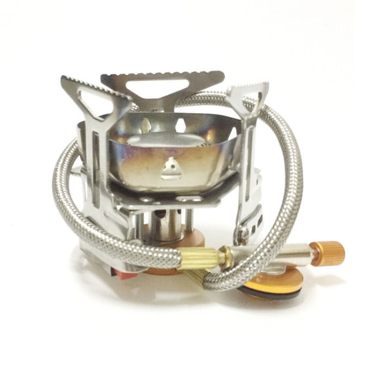 Portable stainless steel camping stove front view with attached gas hose