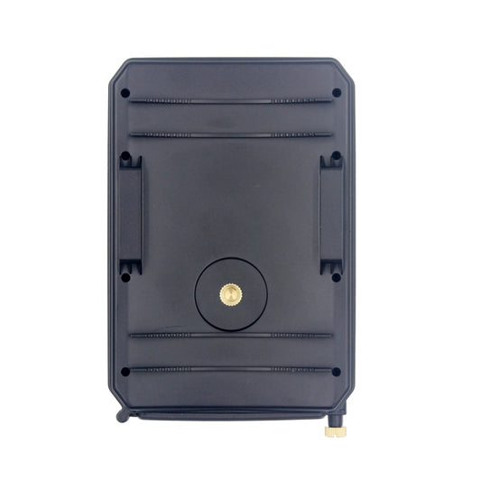 Black hunting trail camera back with mounting holes and round reset button.