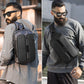 Black chest bag worn crossbody with adjustable strap and front pockets