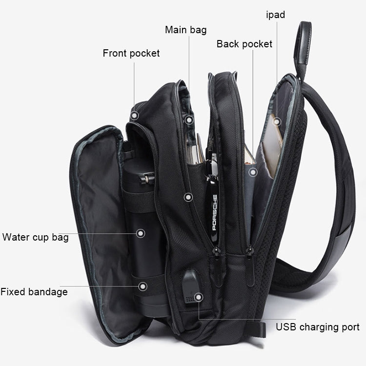Black chest sling bag with multiple compartments, back pocket, and USB charging port
