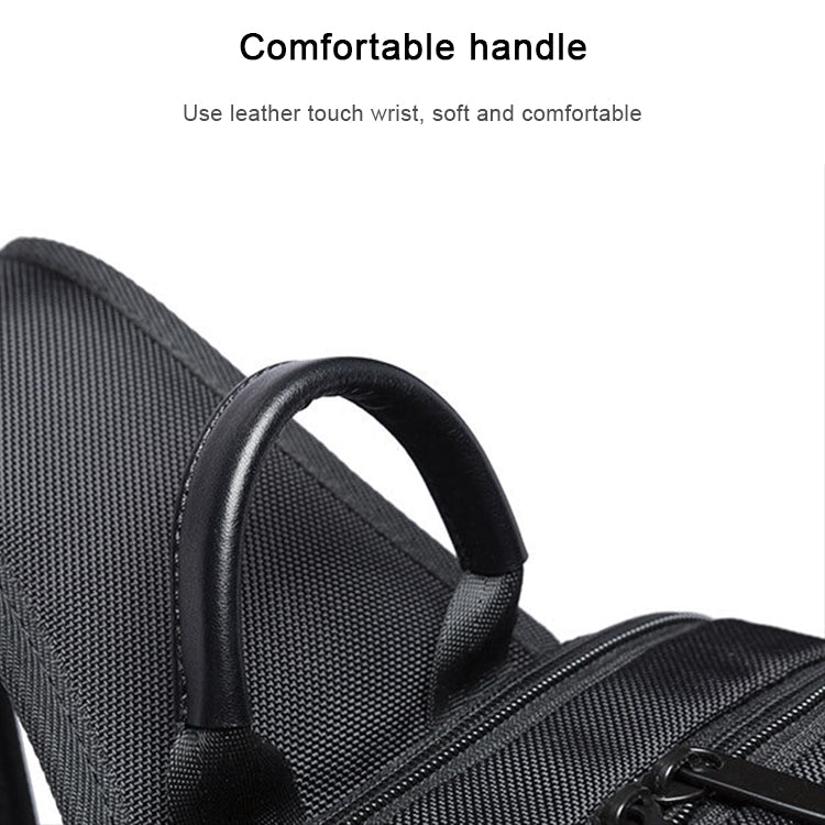 Black textured chest bag with comfortable rounded top handle and smooth zipper edge