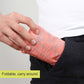 Orange patterned stretch waist pocket bag folded for easy carry