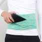 Green patterned stretch waist pocket bag securely holding a smartphone