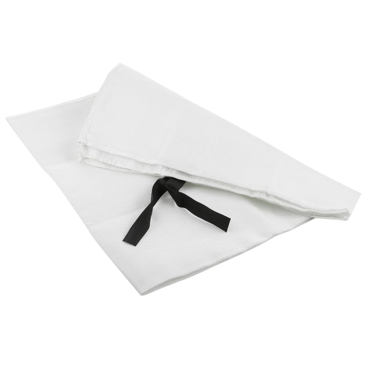 White fire blanket folded with black pull strap