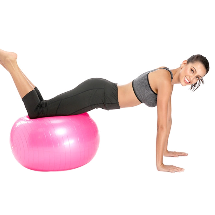 Pink anti-burst fitness yoga ball, textured grip surface, used for balance exercises