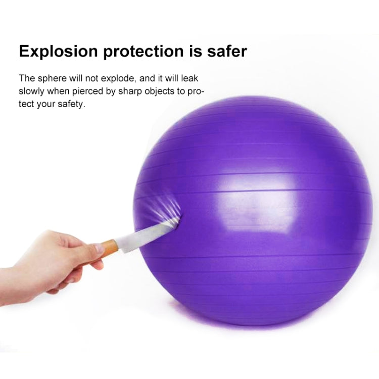 Purple anti-burst fitness yoga ball with puncture tool demonstration