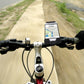 Bicycle phone holder mounted on handlebars, holding a smartphone