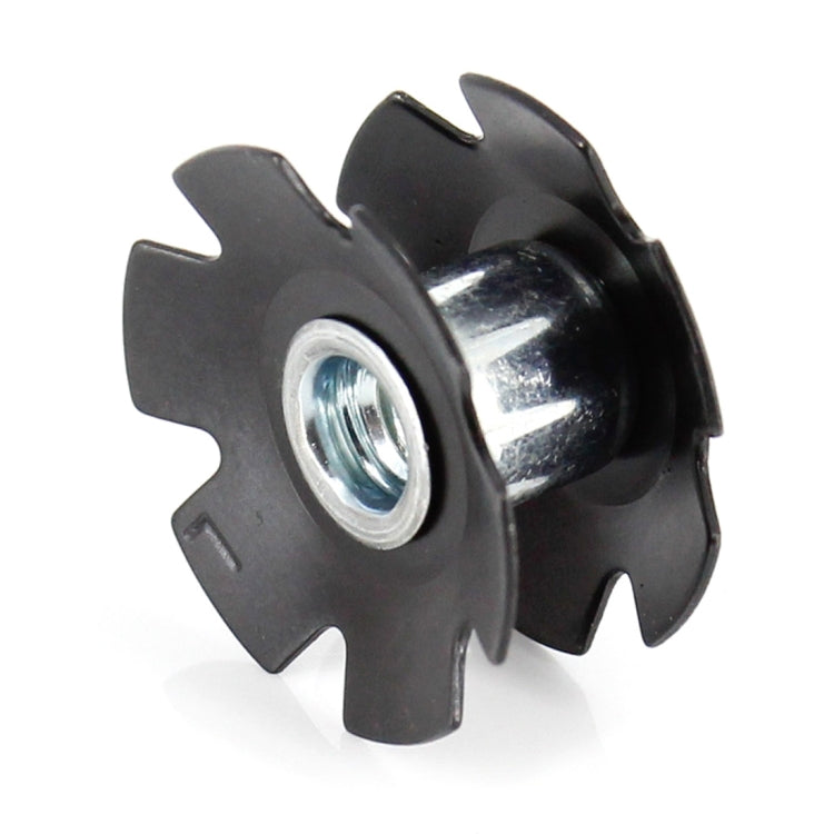 Side view of black star nut with zinc threaded insert for bike headset