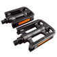 Anti-slip plastic bicycle pedals, black with orange reflector strips, studded grip