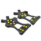 Pair of black ice traction shoe covers with yellow claw grips
