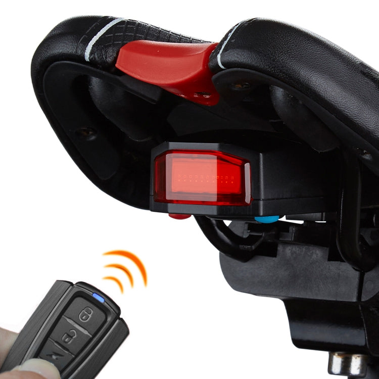 Black cycling tail light with red lens and compact alarm control mount