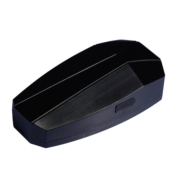 Black rectangular bike tail light with textured panel and side indicator slot