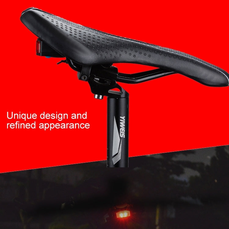 Smart bike tail light on seat post with bright red glow and sleek black bracket