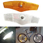Amber and white bike spoke reflectors with clear lenses and center mounting screws