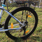 Amber bike spoke reflector on front wheel spokes with visible center mounting screw