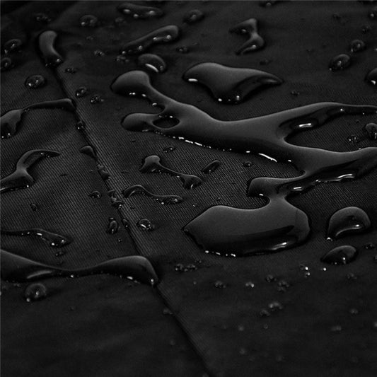 Black waterproof grill cover fabric with water droplets on textured surface