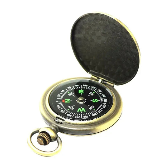 Vintage metal pocket compass watch with black textured lid and compass dial, gold-tone case