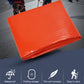 Orange long rain poncho, folded compactly in a square stack