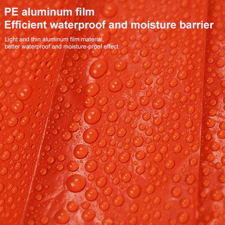 Orange waterproof rain poncho fabric with visible water droplets