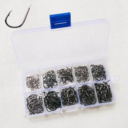 Mixed size barbed fish hooks set in plastic tackle organizer box