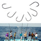 Assorted barbed fishing hooks arranged with curved points