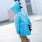 Children's blue dinosaur raincoat with hood and fin-like shoulder details