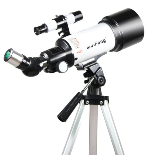 Astronomical telescope with silver tube, black mount, and tripod legs in angled view