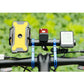 Carbon fiber handlebar extension bracket mounted on bike with accessory light holder