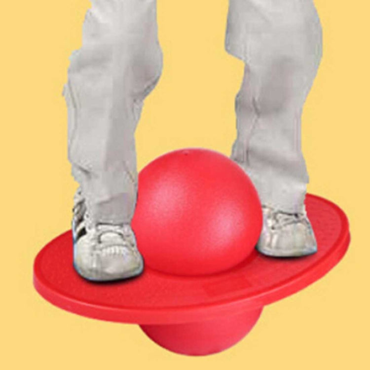 Red inflatable balance jumping ball with dome top resting on base pedal