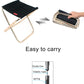 Black folding stool with aluminum frame, shown being folded into compact shape