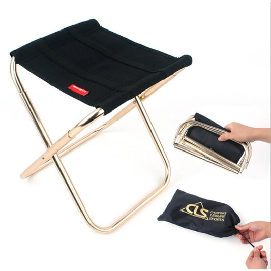 Black folding camping stool with aluminum frame and padded seat, portable design