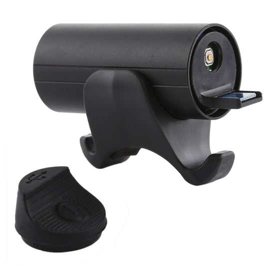 Black bicycle front lamp with visible LED module and attached rubber foot