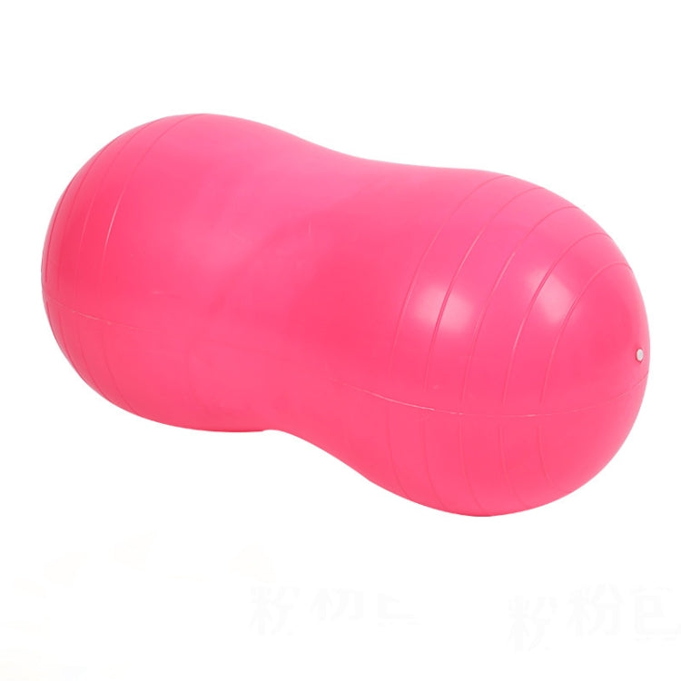Pink peanut-shaped exercise and massage ball with smooth glossy surface and seams