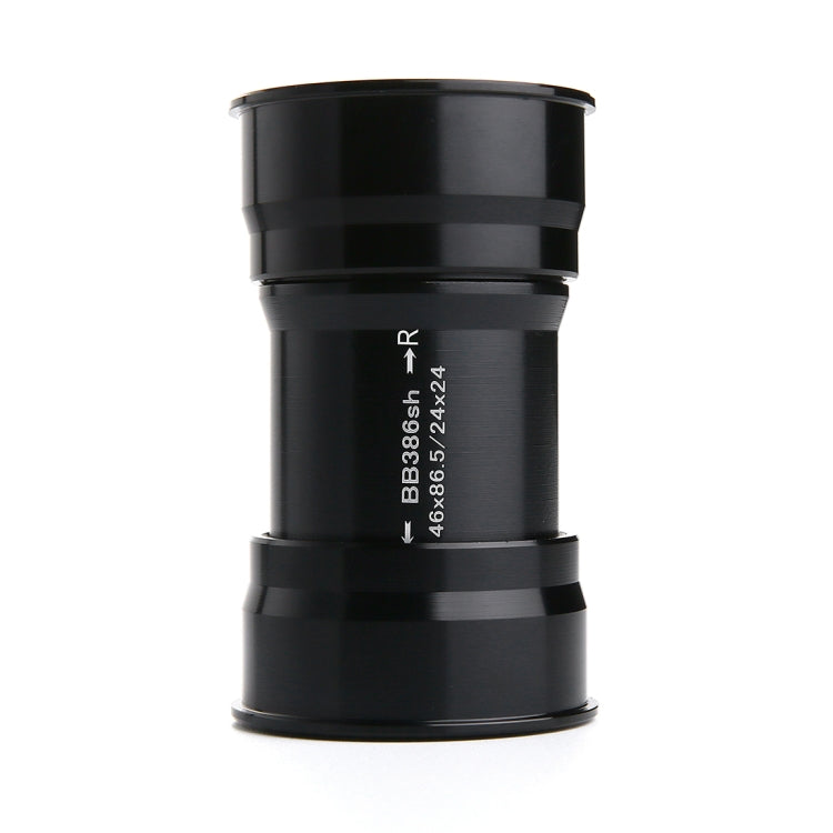 Black BB386 press-fit bottom bracket cup, printed size text and arrow markings