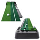Golf putting mat trainer with white balls and auto ball return chute on dark base
