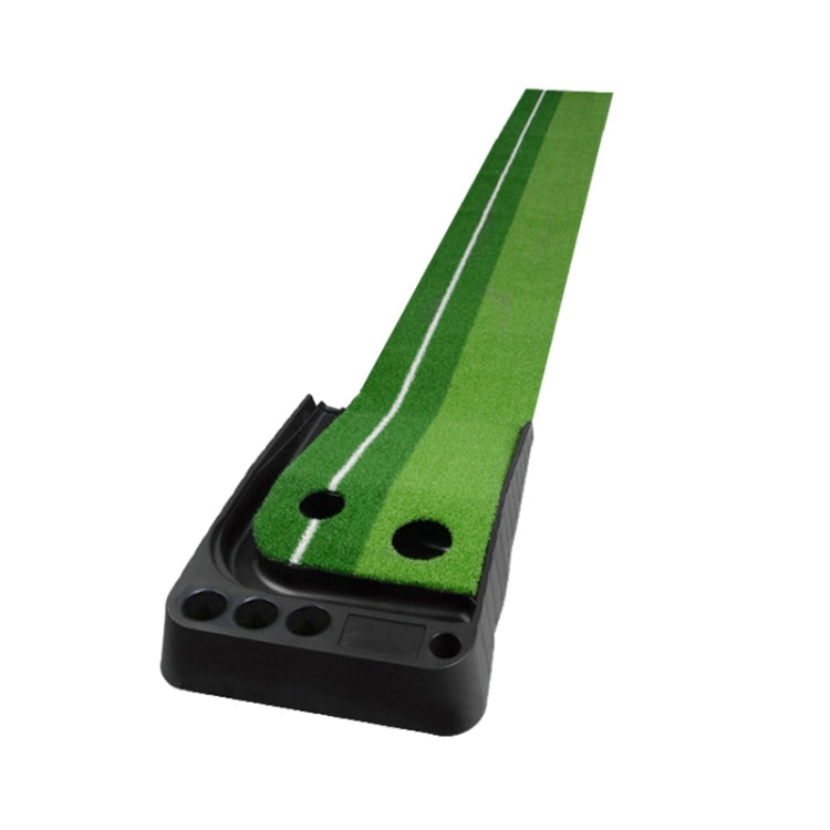 Green artificial grass putting mat with two holes on a black base