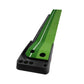 Green golf mini putting mat trainer on black base with push-rod channel for balls