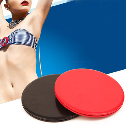 Pair of round exercise gliding discs, red and black, stacked for core workouts