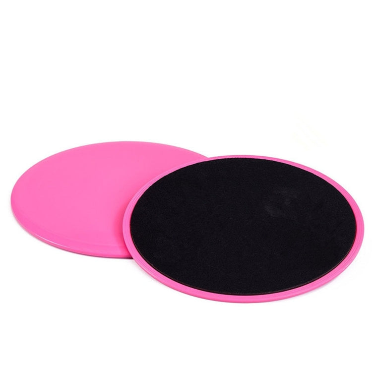 Set of round gliding discs, pink and black, stacked