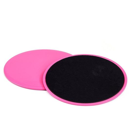 Set of round gliding discs, pink and black, stacked