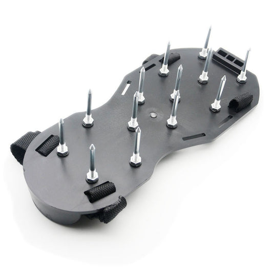Spiked garden shoe plate with raised spikes and fastening straps, close-up
