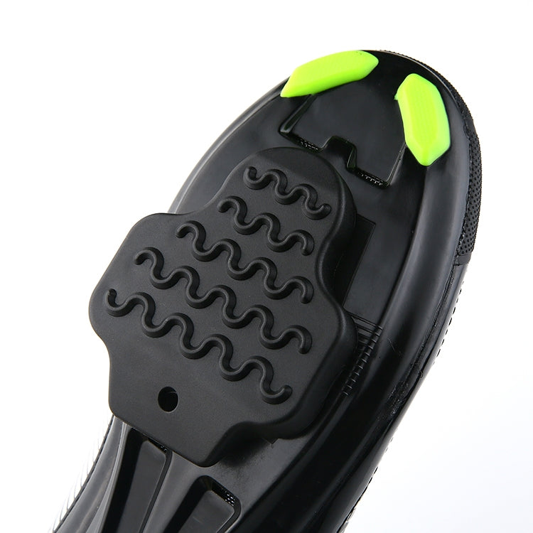 Black cycling shoe with black rubber cleat cover and bright neon green accents